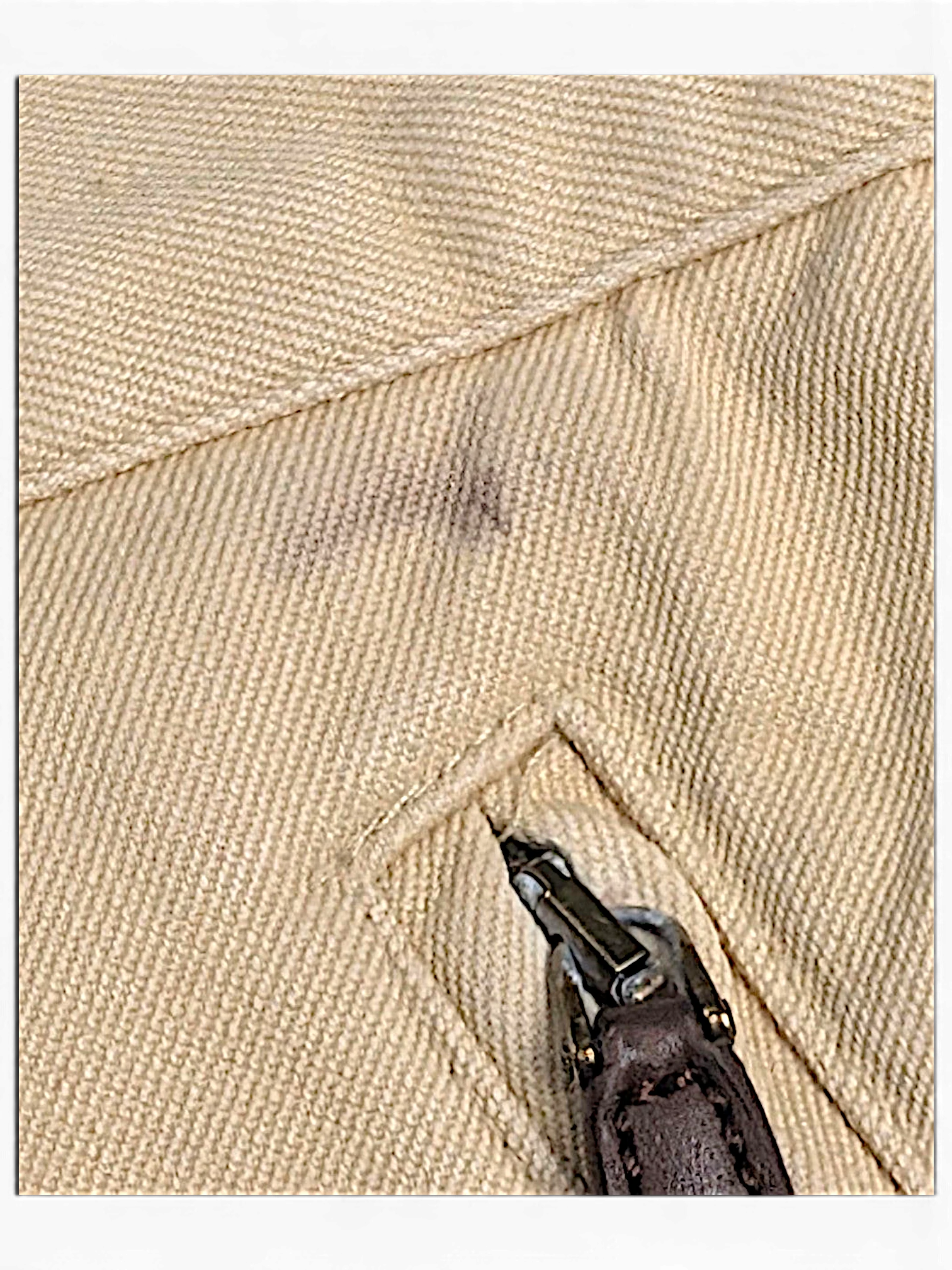 JAKE & IPI Lauren Ralph Lauren beige trousers showing a dark stain near the zippered pocket detail