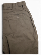 JAKE & IPI Lee Performance Khakis beige pleated trousers featuring a rear buttoned welt pocket
