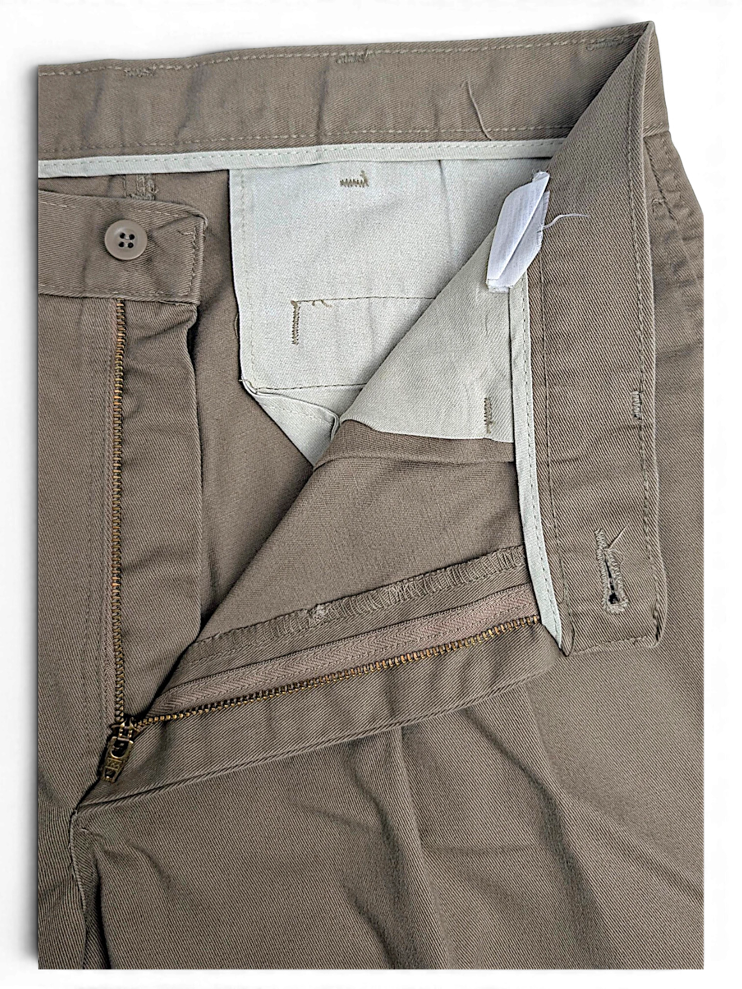 JAKE & IPI Lee Performance Khakis beige pleated trousers showing the zipper fly, button closure, and interior lining.