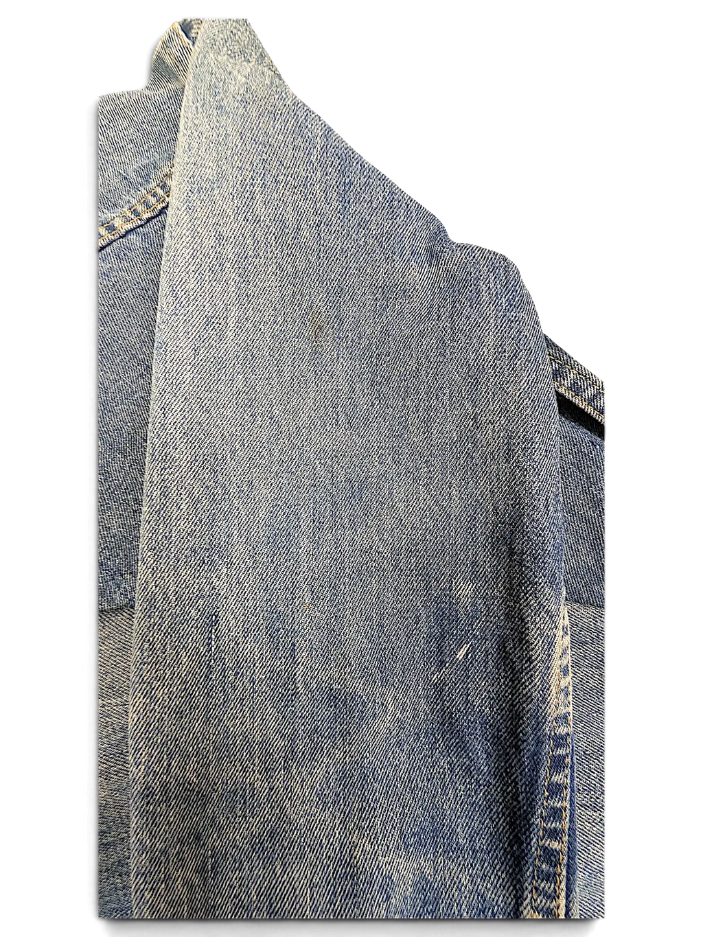 Close-up of a JAKE & IPI LEE denim jacket in light blue wash showing texture and stitching details.