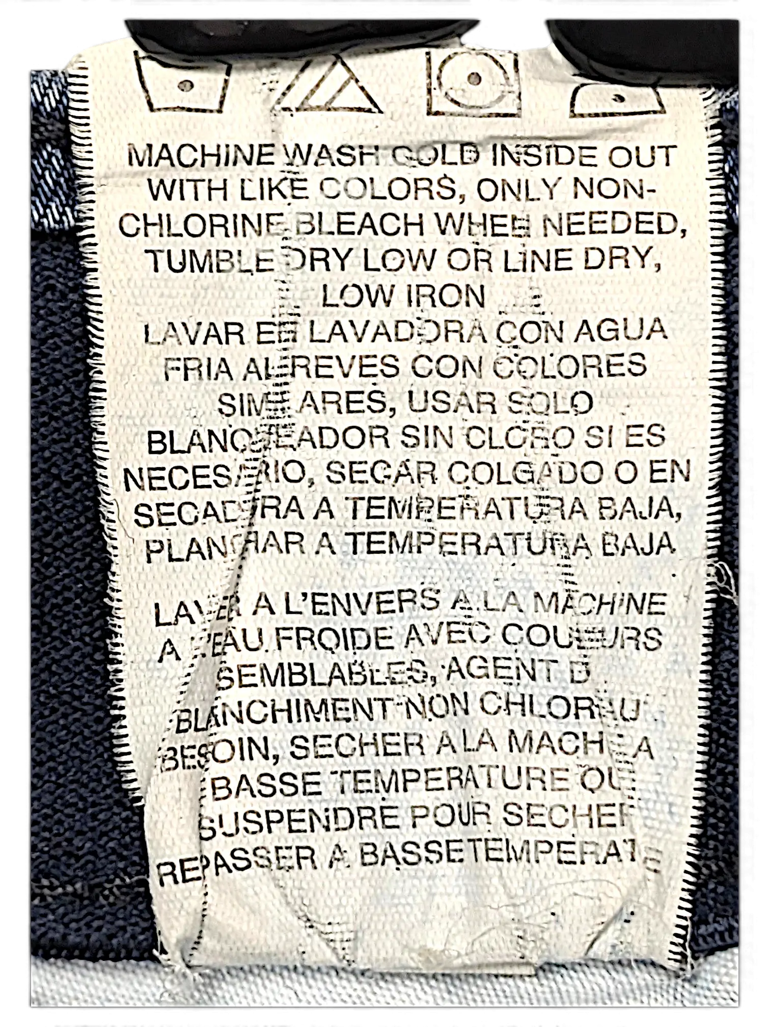 JAKE & IPI Lee Plus regular fit jeans care label with washing instructions in English, Spanish, and French.