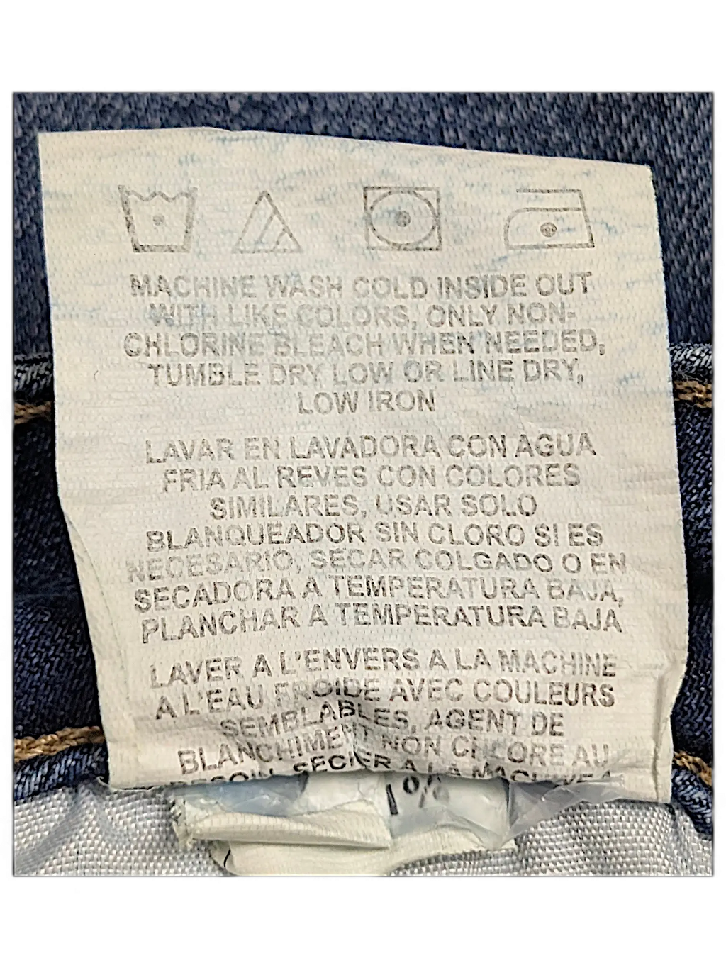 JAKE & IPI Lee Riders midrise straight jeans care label with washing instructions in English, Spanish, and French