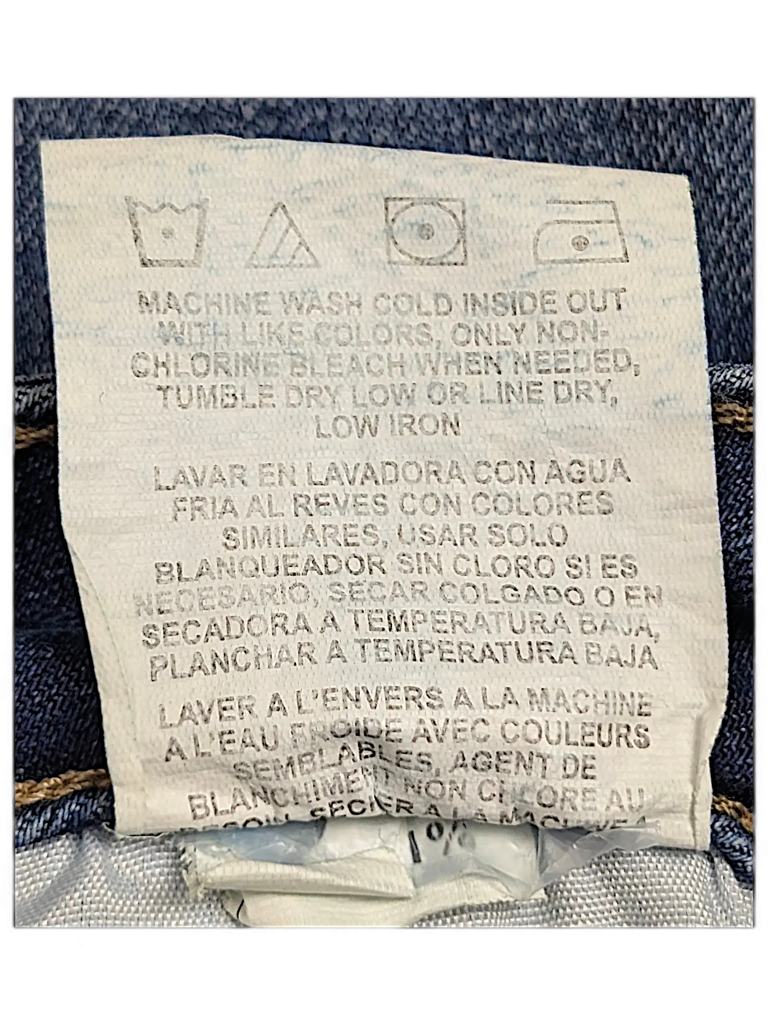 JAKE & IPI Lee Riders midrise straight jeans care label with washing instructions in English, Spanish, and French