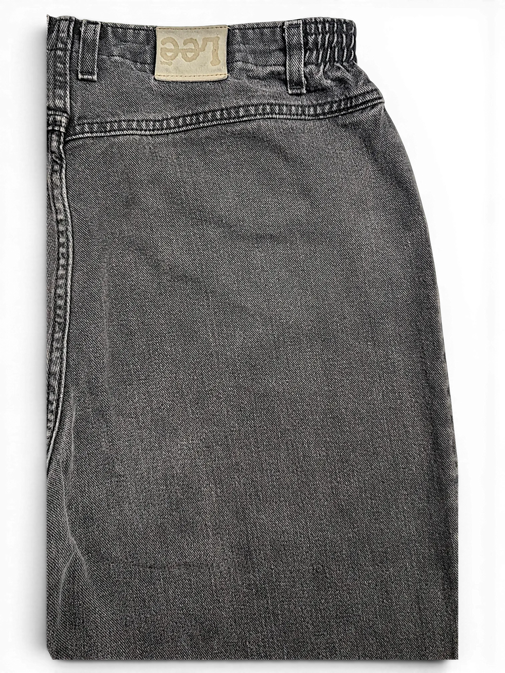 JAKE & IPI Lee stretch waist jeans in washed black denim with a leather brand patch on the back waistband.