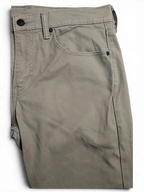 JAKE & IPI pre-owned Levi’s 511 slim fit jeans in beige stretch cotton denim with classic five-pocket styling.