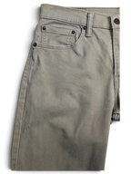 JAKE & IPI pre-owned Levi’s 511 slim fit jeans in beige stretch cotton denim with classic five-pocket detailing.
