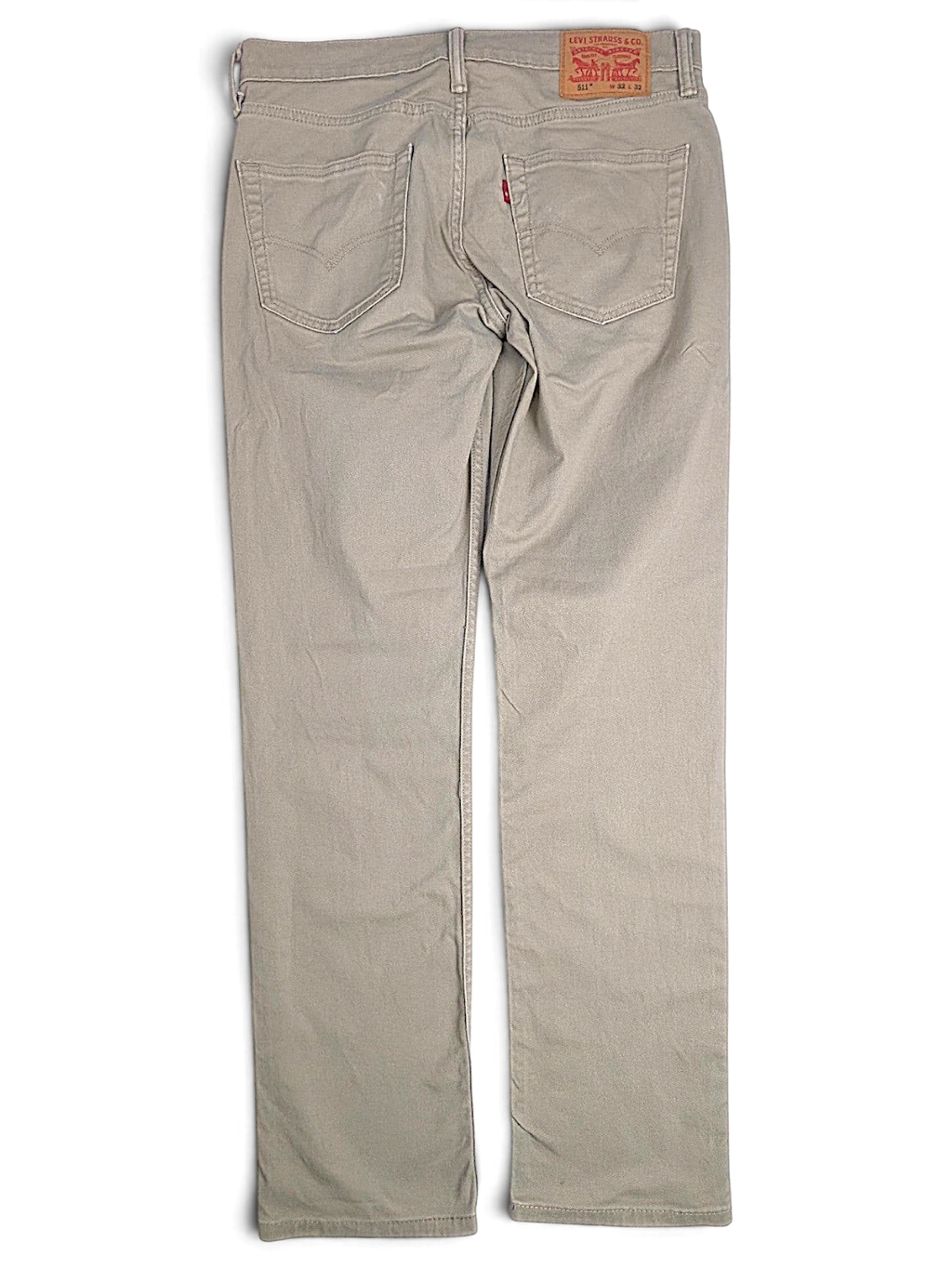 JAKE & IPI pre-owned Levi’s 511 slim fit beige stretch denim jeans, back view with leather patch and red tab.