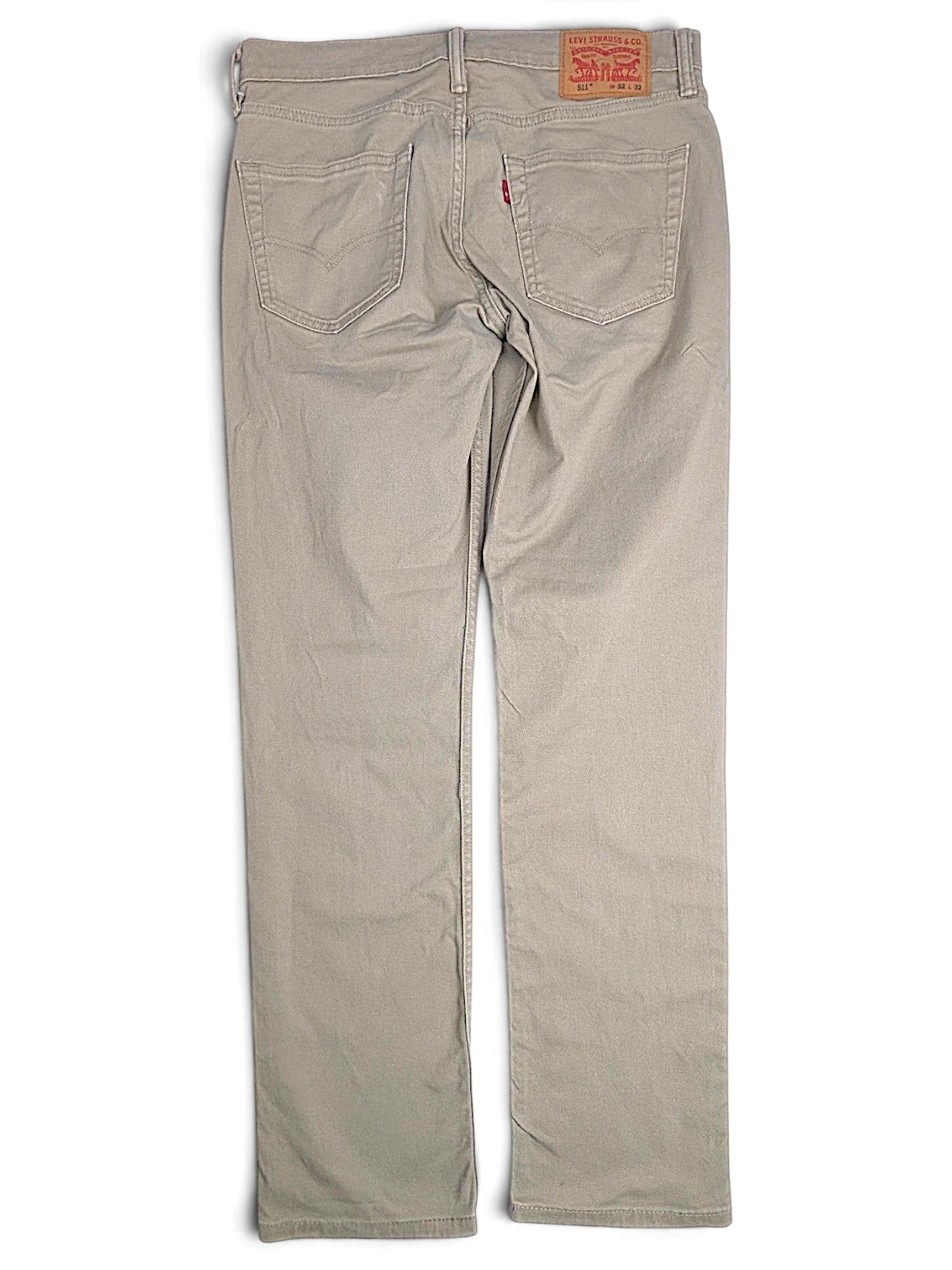 JAKE & IPI pre-owned Levi’s 511 slim fit beige stretch denim jeans, back view with leather patch and red tab.