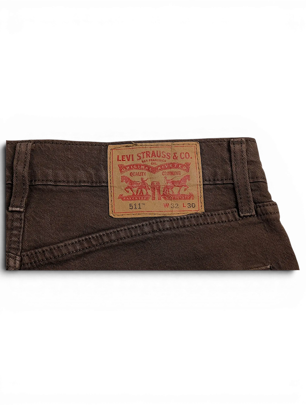 JAKE & IPI Levi's 511 brown jeans featuring the iconic tan leather back patch with size W32 L30 details