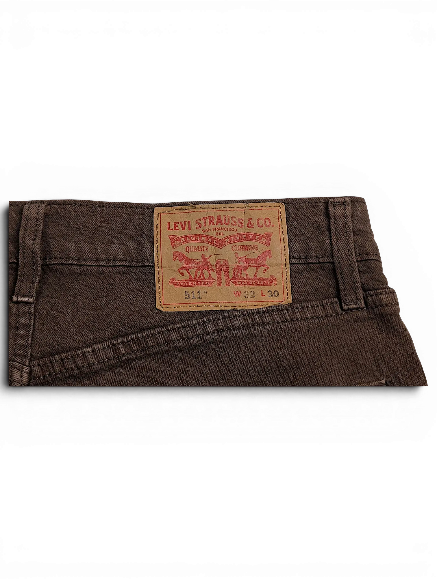 JAKE & IPI Levi's 511 brown jeans featuring the iconic tan leather back patch with size W32 L30 details