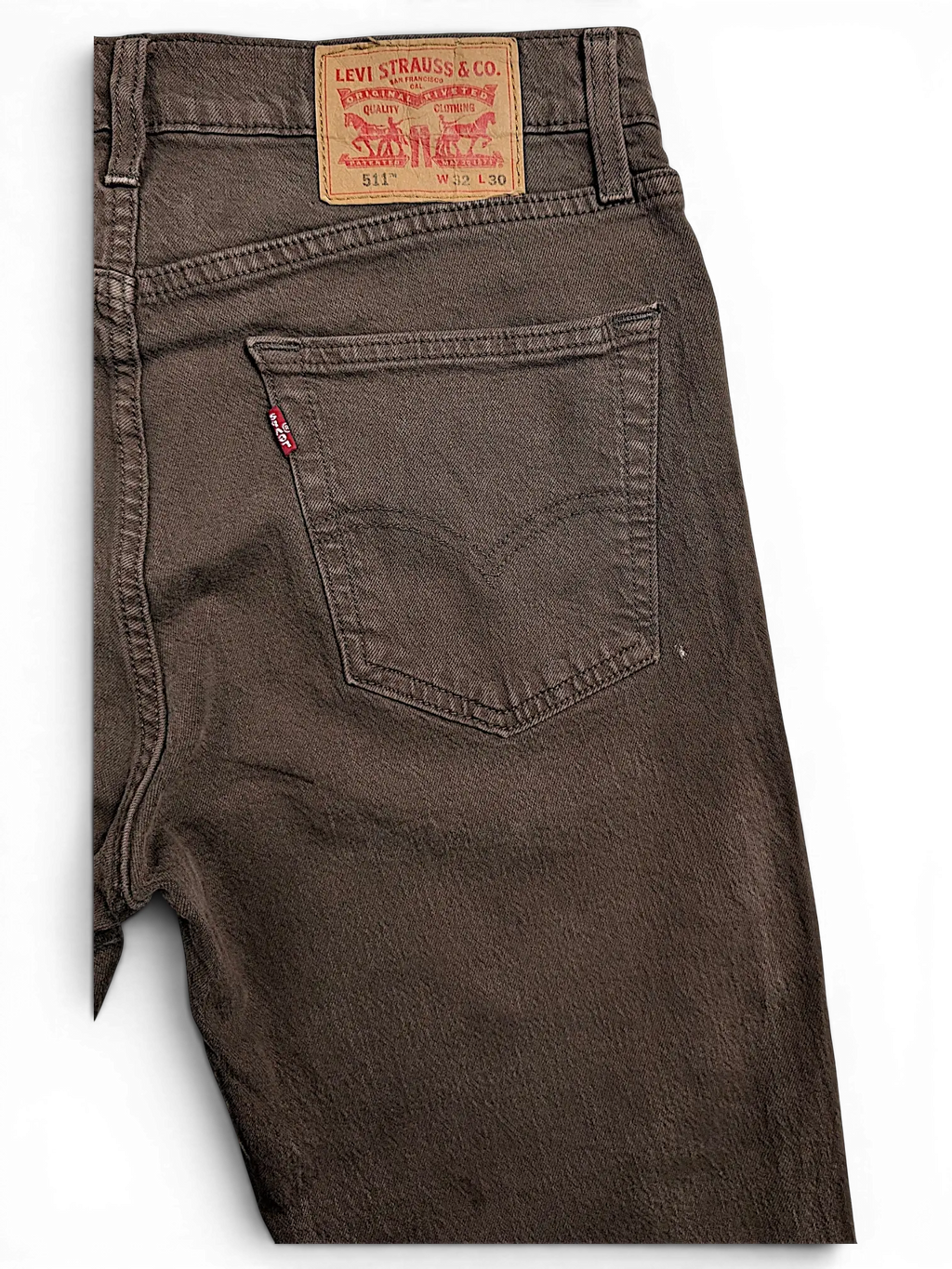 JAKE & IPI brown Levi's 511 slim fit jeans featuring a leather back patch and signature red tab on the pocket