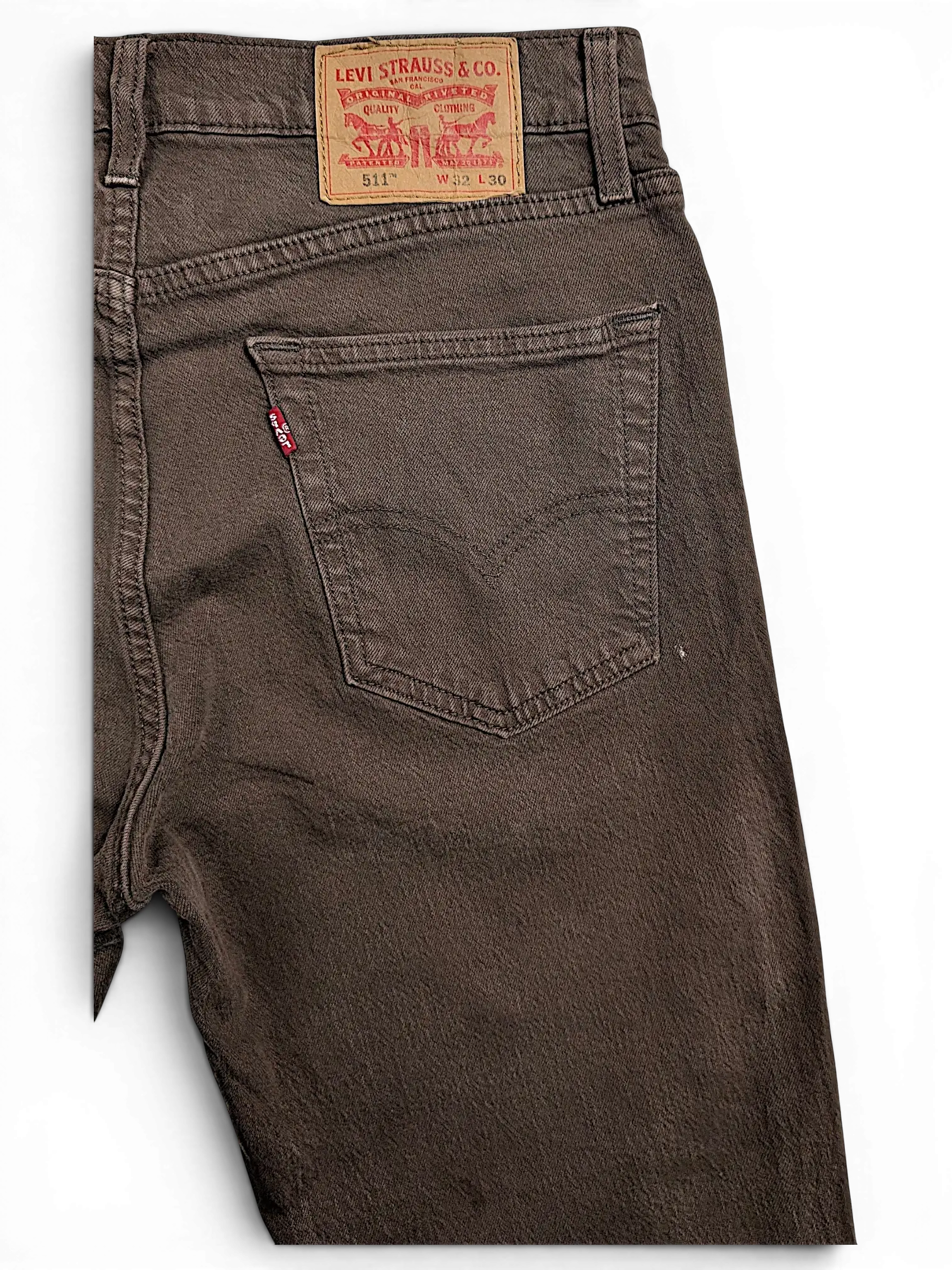 JAKE & IPI brown Levi's 511 slim fit jeans featuring a leather back patch and signature red tab on the pocket