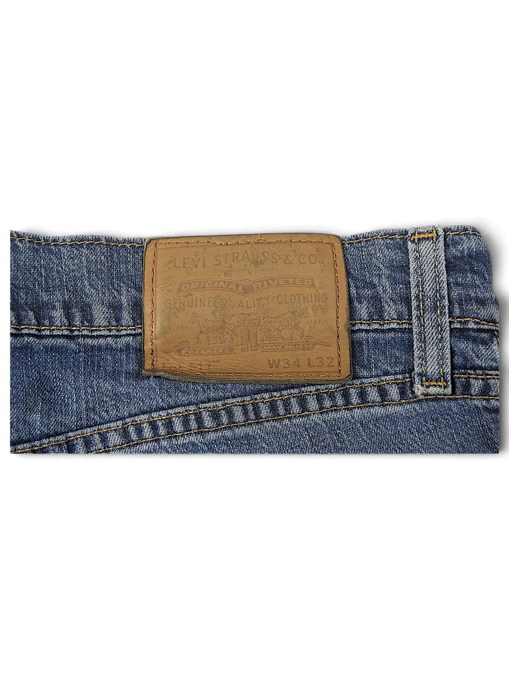 JAKE & IPI Levi's 511 blue denim jeans featuring a brown leather back waist patch with size W34 L32 details