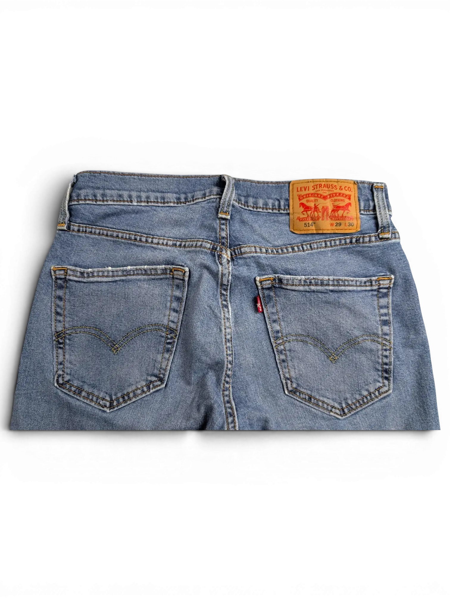 JAKE & IPI Levi's 514 blue denim jeans featuring back pockets with signature stitching and a leather waist patch