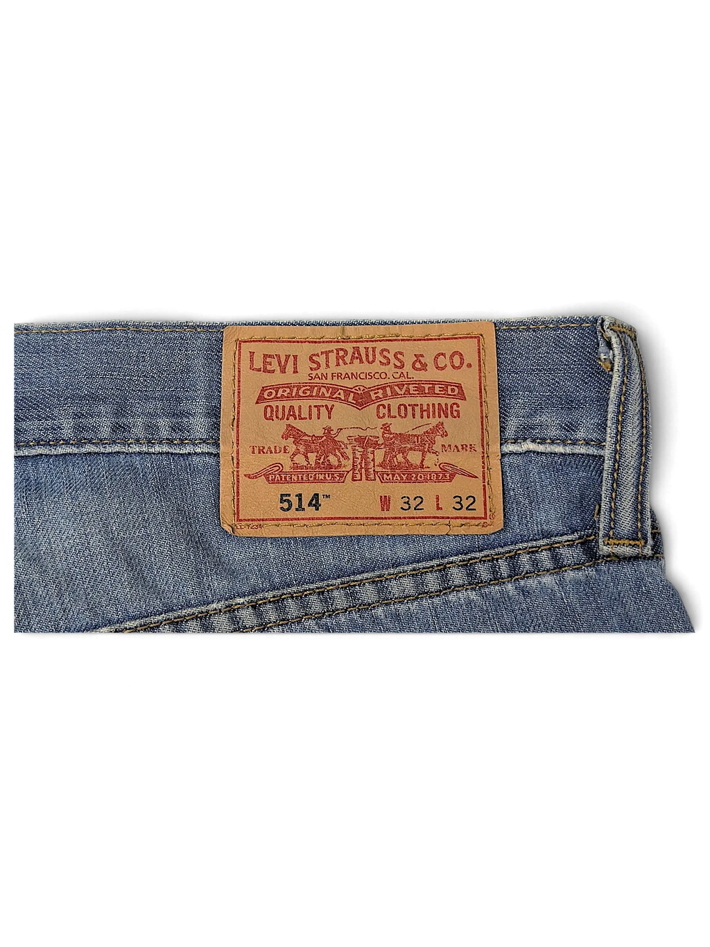 JAKE & IPI Levi's 514 jeans featuring a classic tan leather brand patch on the back waistband