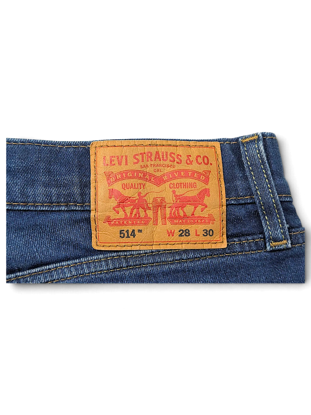 JAKE & IPI Levi's 514 jeans featuring the classic tan leather back patch on dark blue denim fabric