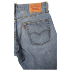 JAKE & IPI Levi's 514 vaaleat farkut klassisella viisitaskumallilla ja nahkaisella takamerkillä.