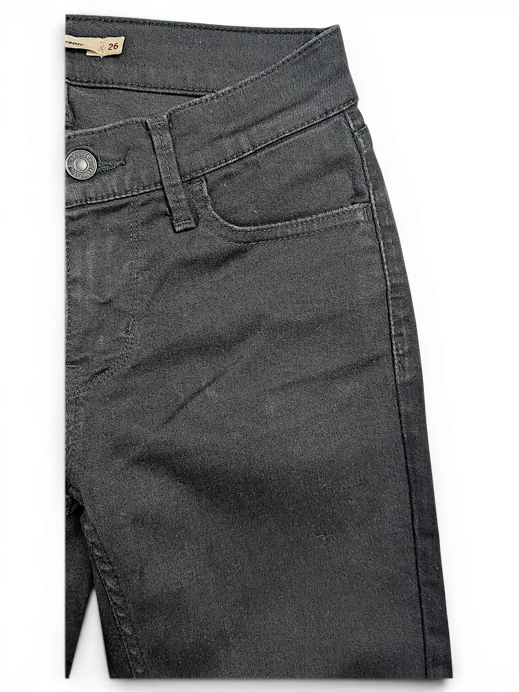 JAKE & IPI Levi's 710 super skinny black denim jeans featuring a classic button fly and front pocket detail.