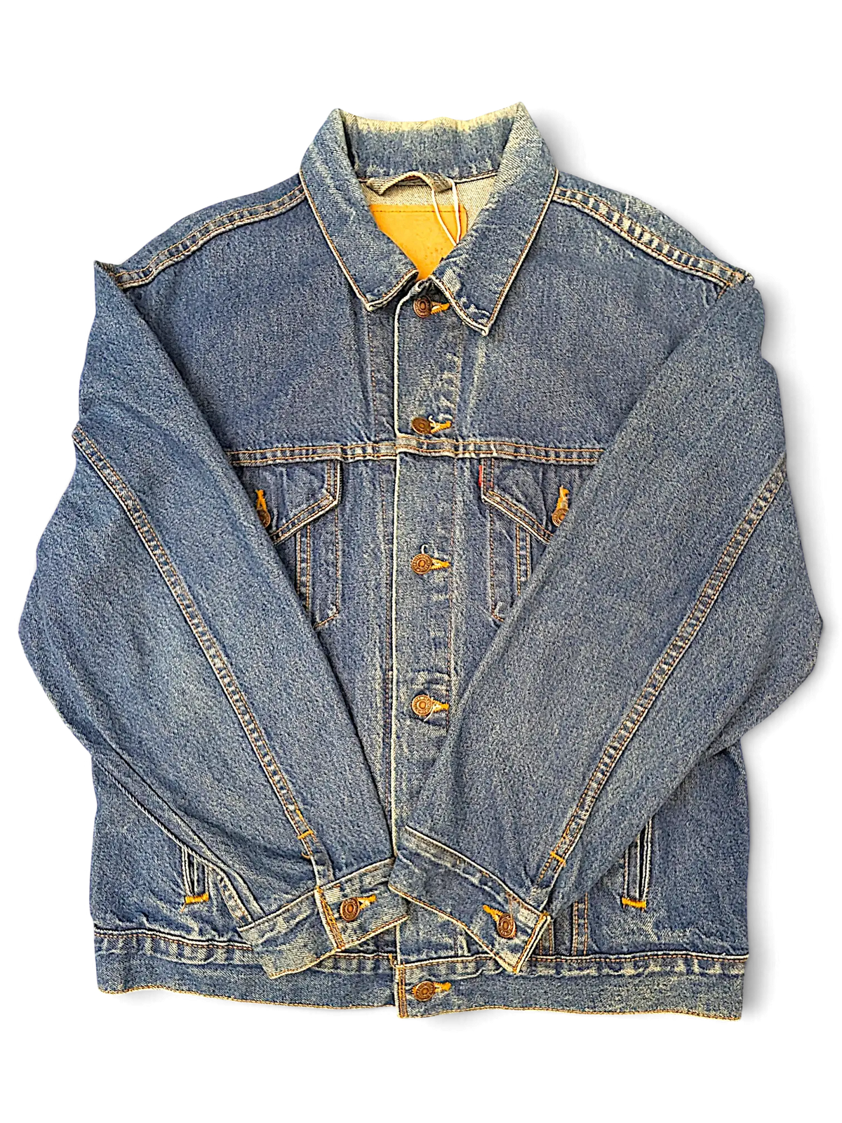 JAKE & IPI Levi's tagless blue denim jacket with classic button-up front and chest pockets on a black background