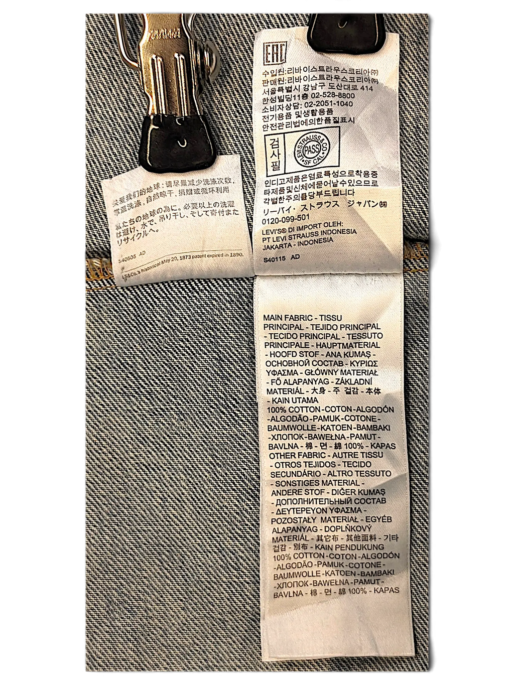 JAKE & IPI Levi's denim jacket interior care and material label showing 100% cotton composition in multiple languages.