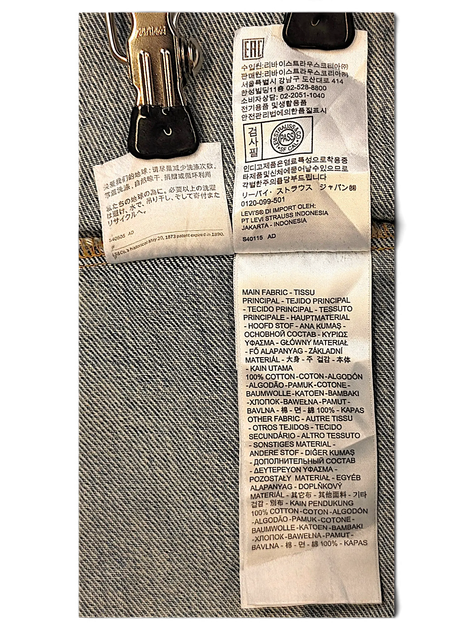 JAKE & IPI Levi's denim jacket interior care and material label showing 100% cotton composition in multiple languages.