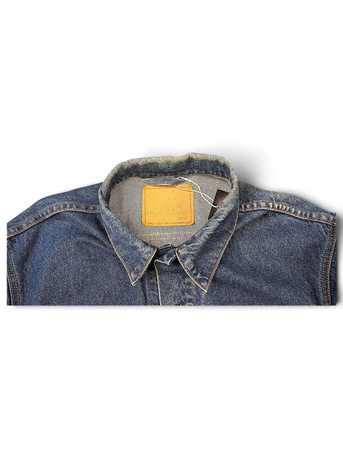 JAKE & IPI Levi's tagless blue denim jacket collar with a tan leather patch on a black background