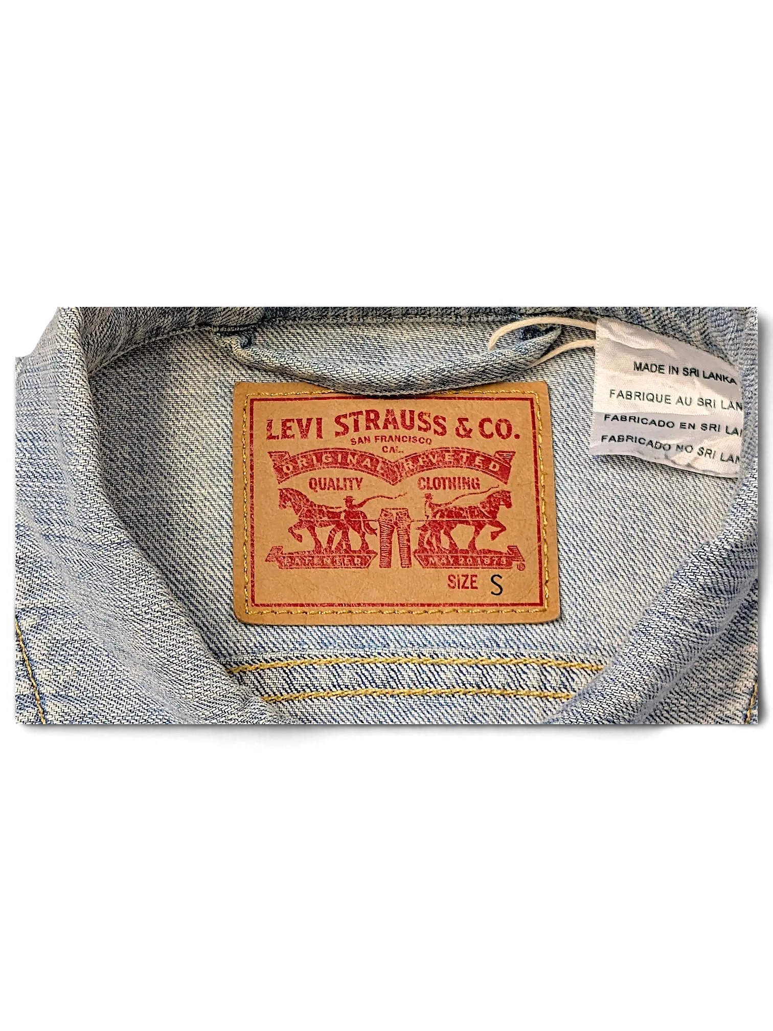 JAKE & IPI Levi Strauss & Co. light wash denim jacket interior label showing size S and Sri Lanka origin tag