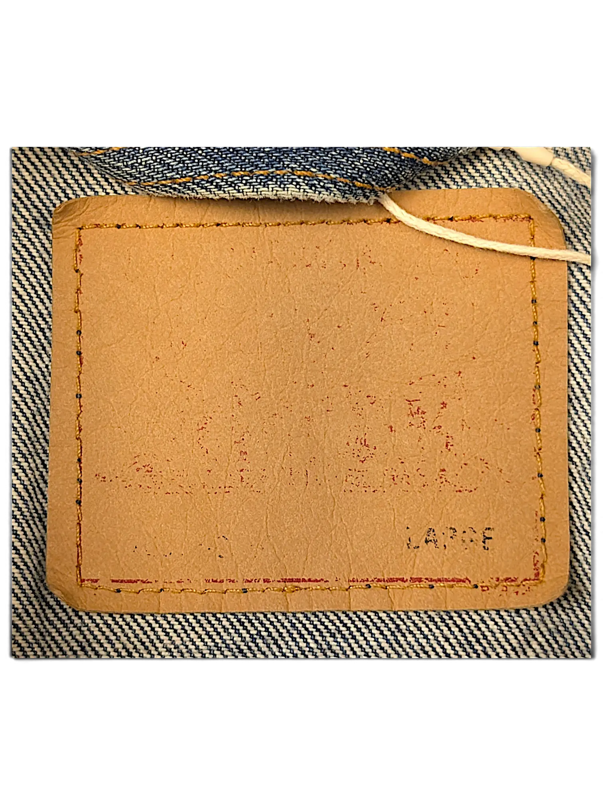 JAKE & IPI Levi's denim jacket tan leather size label with red stitching detail
