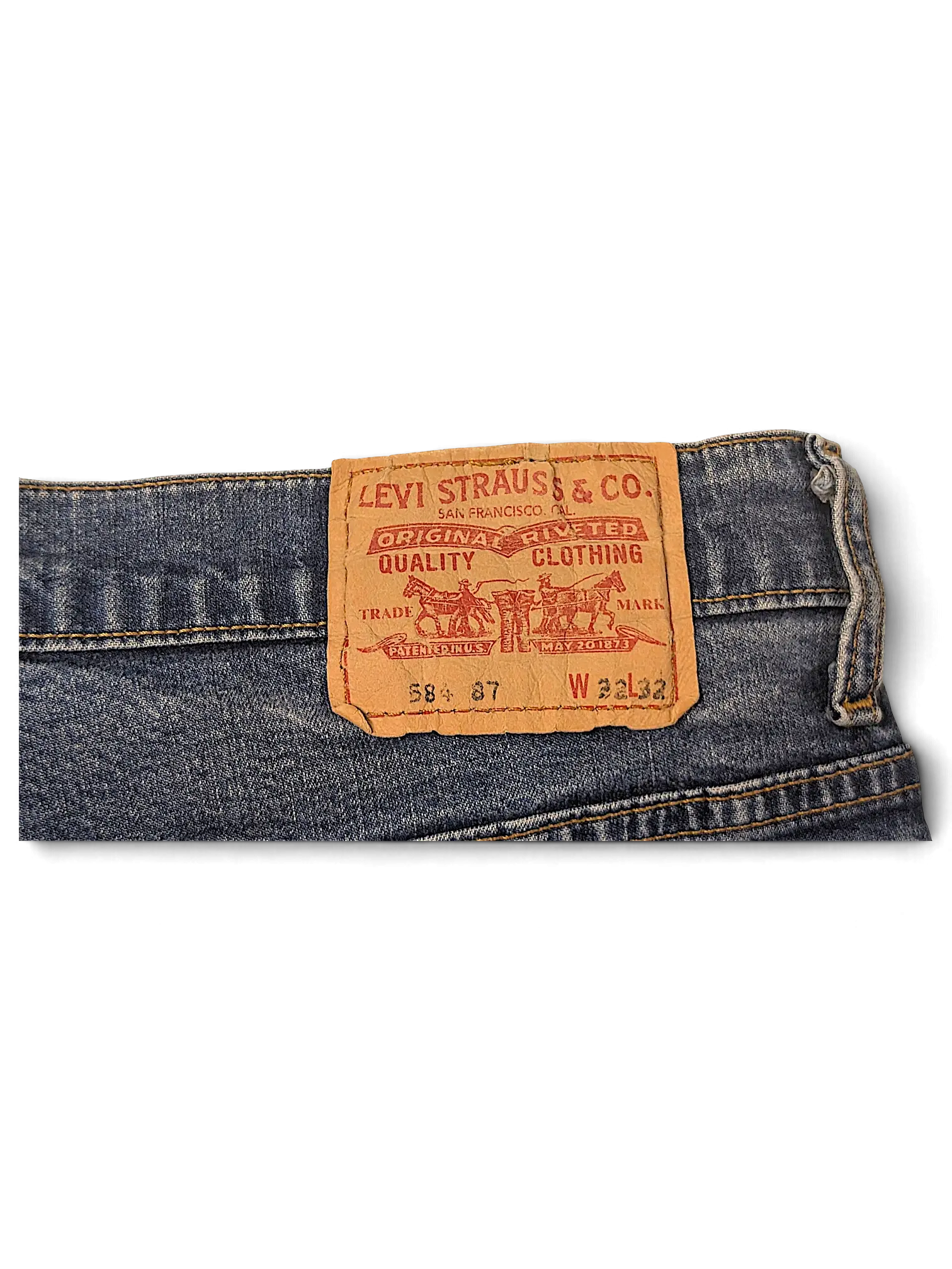 JAKE & IPI Levi's 584 87 denim jeans featuring a classic tan leather brand patch on the back waistband