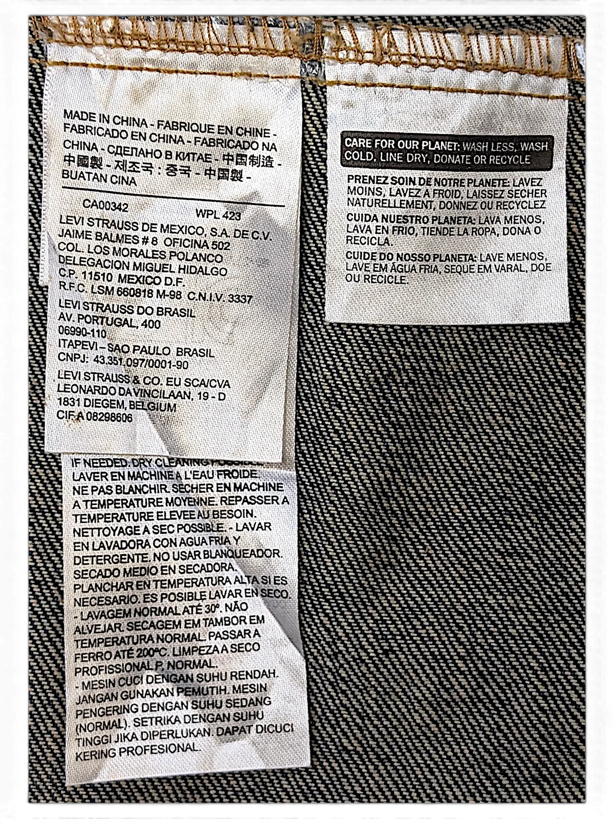 JAKE & IPI Levi's denim vest garment care label with washing instructions and manufacturing details
