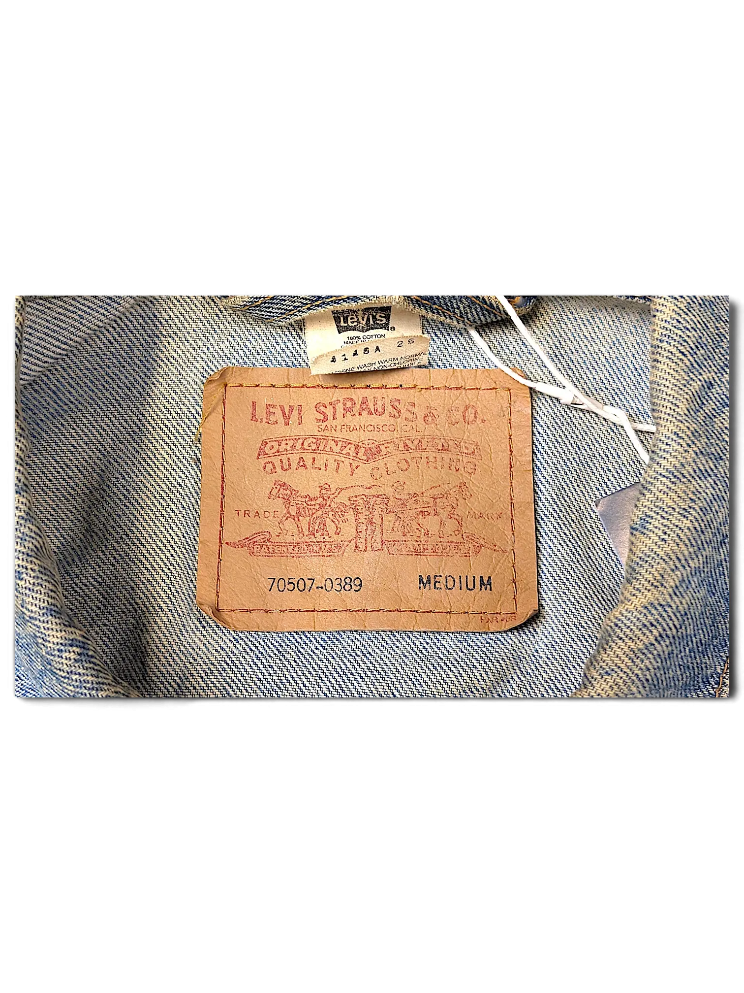 JAKE & IPI Levi's Strauss distressed denim jacket featuring a classic brown leather brand patch and size medium label.