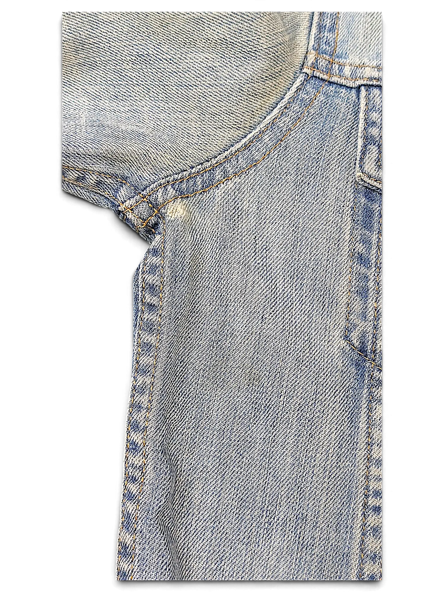 Close-up of JAKE & IPI Levi's distressed light wash denim jacket showing shoulder stitching and fabric texture