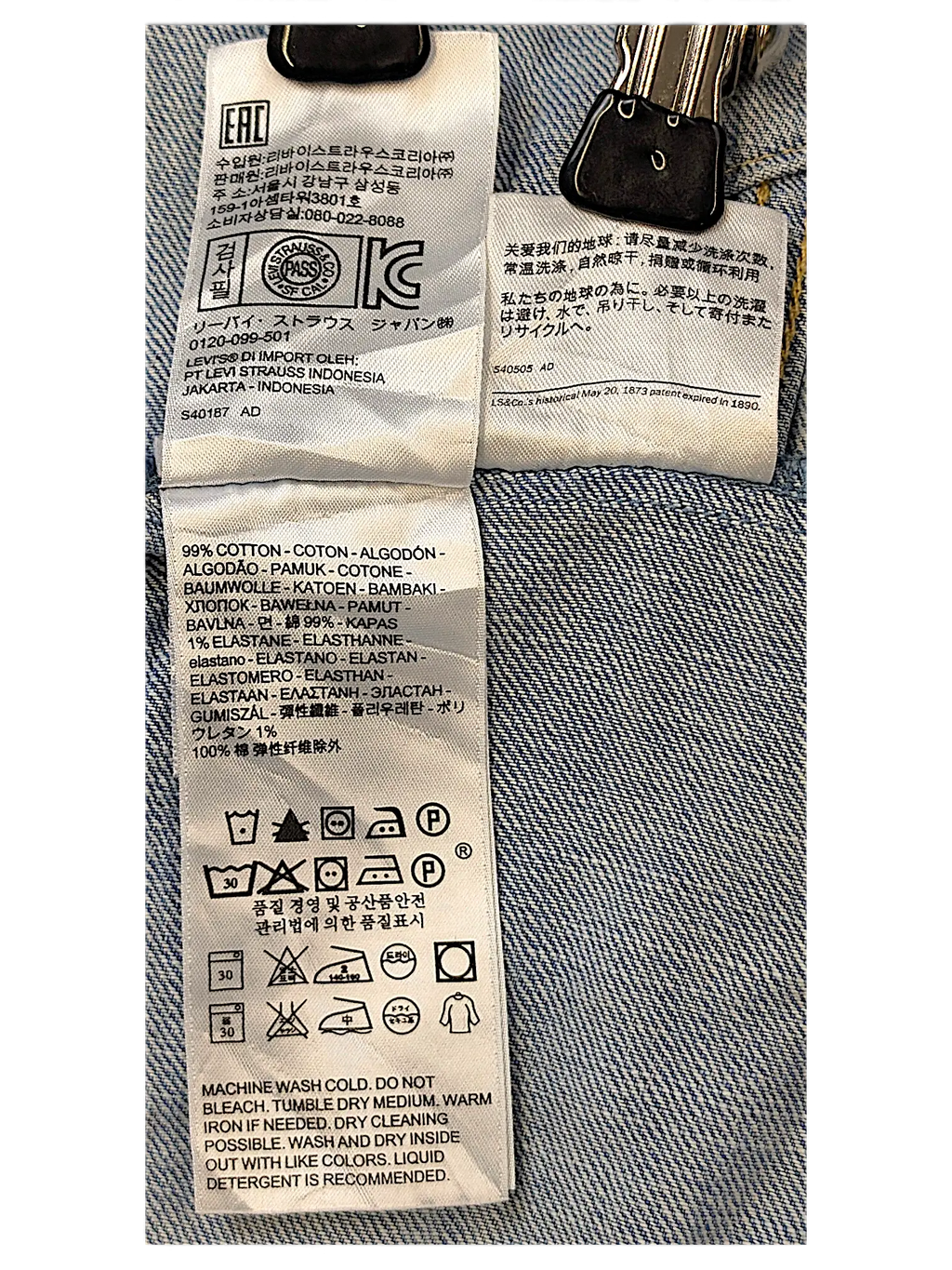 JAKE & IPI Levi's Strauss girls jacket care label showing 99% cotton and 1% elastane fabric composition