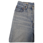 JAKE & IPI Levi's light wash denim jeans featuring a classic five-pocket construction and copper rivets.