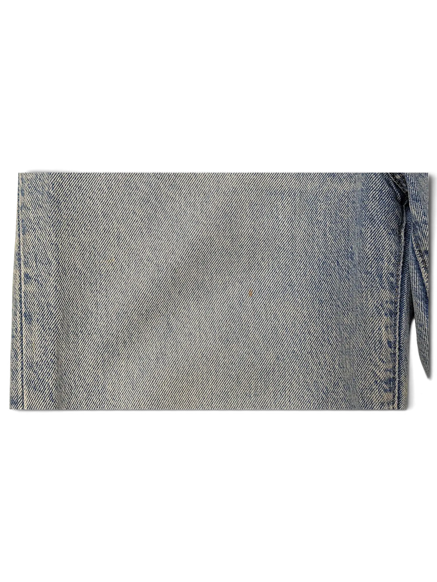 JAKE & IPI Levi's light wash denim jeans showing fabric texture and a small spot detail