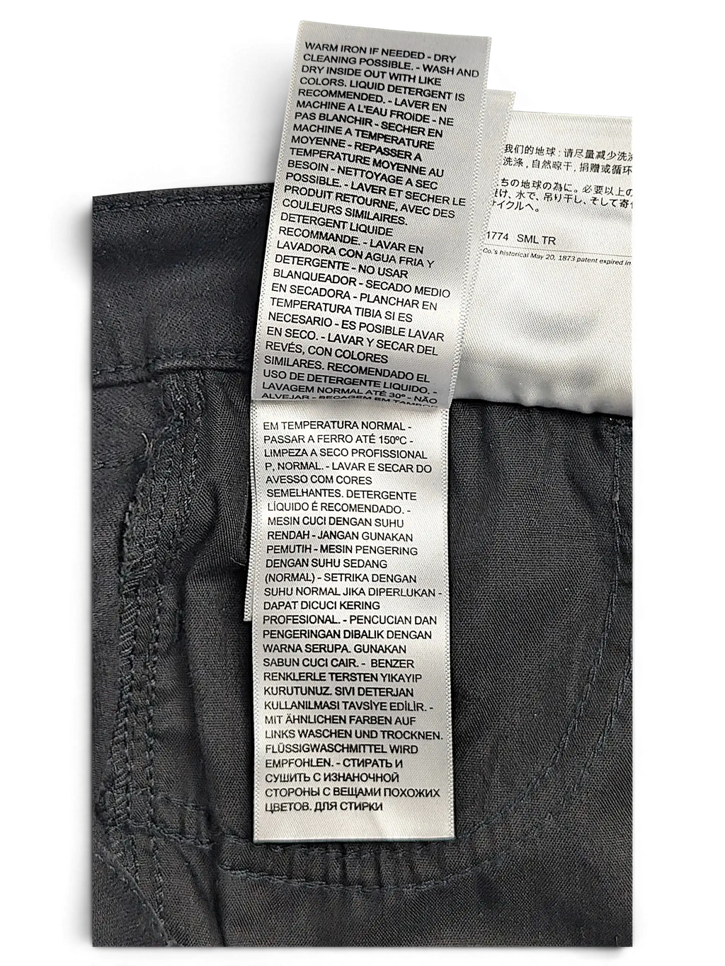 JAKE & IPI Levi's 710 Super Skinny jeans care label with multi-language washing instructions on dark grey fabric