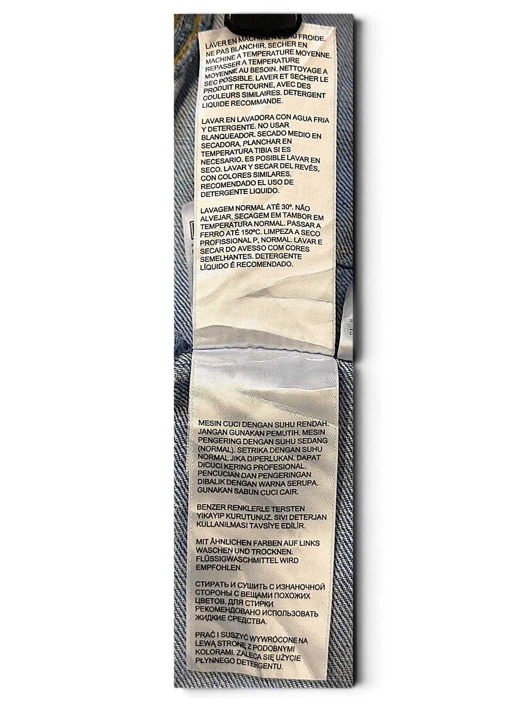 JAKE & IPI Levi's Strauss S girls jacket care label with multi-language washing instructions on light blue denim