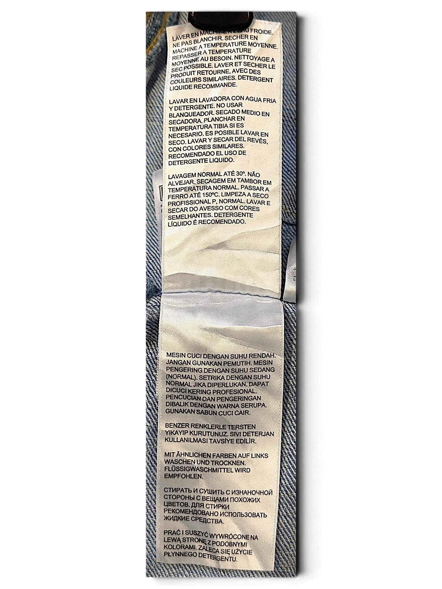 JAKE & IPI Levi's Strauss S girls jacket care label with multi-language washing instructions on light blue denim