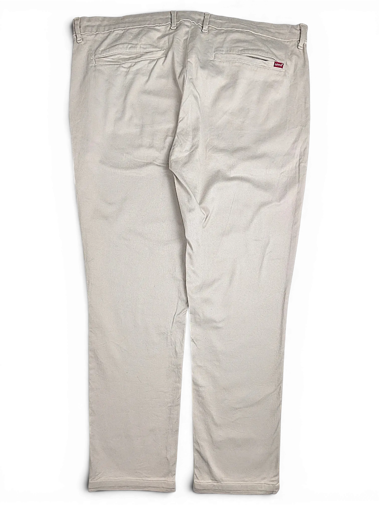 Back view of beige Levi's XX Chino 511 trousers from JAKE & IPI featuring a small red brand tag on the pocket.