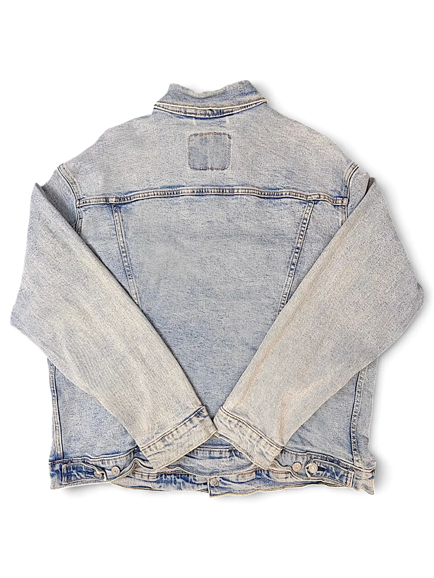 Back view of a JAKE & IPI light wash blue denim jacket with classic stitching and buttoned cuffs.