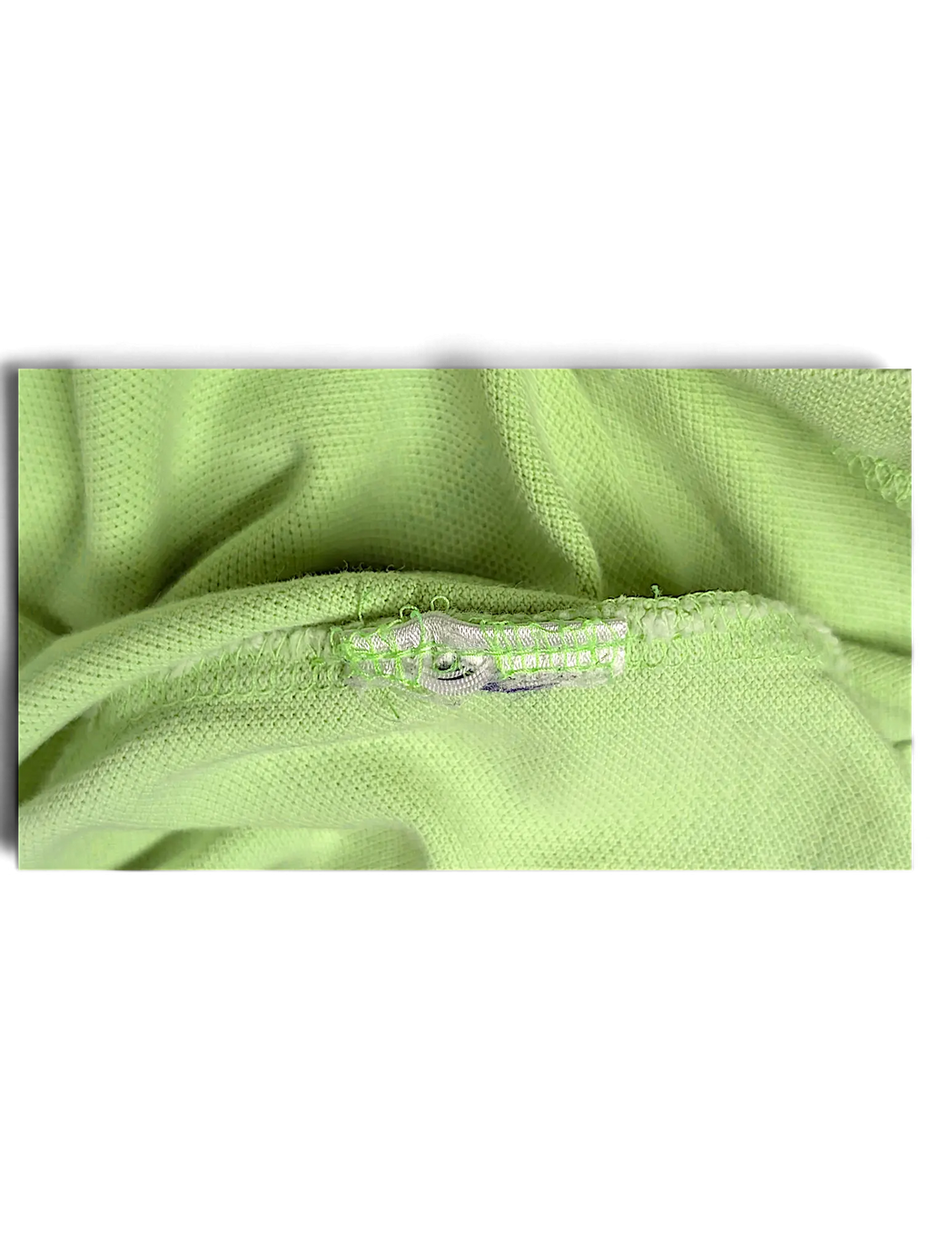 Close-up of JAKE & IPI lime green classic fit polo shirt fabric texture and interior seam detail