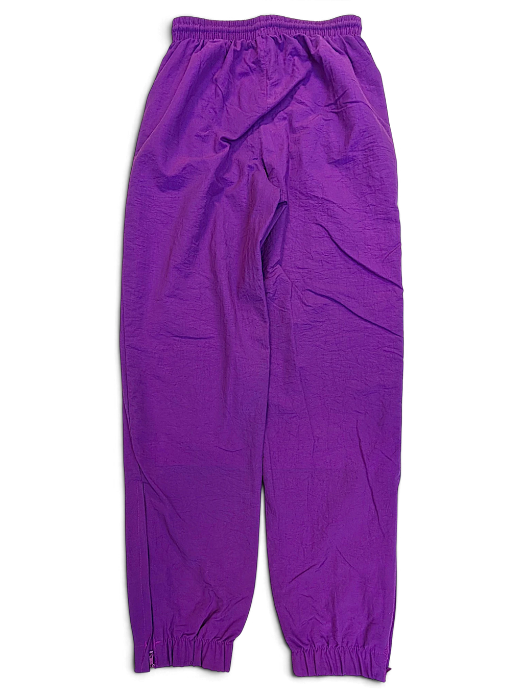 JAKE & IPI pre-owned Lotto purple track pants with an elasticated waistband and cuffed ankles.