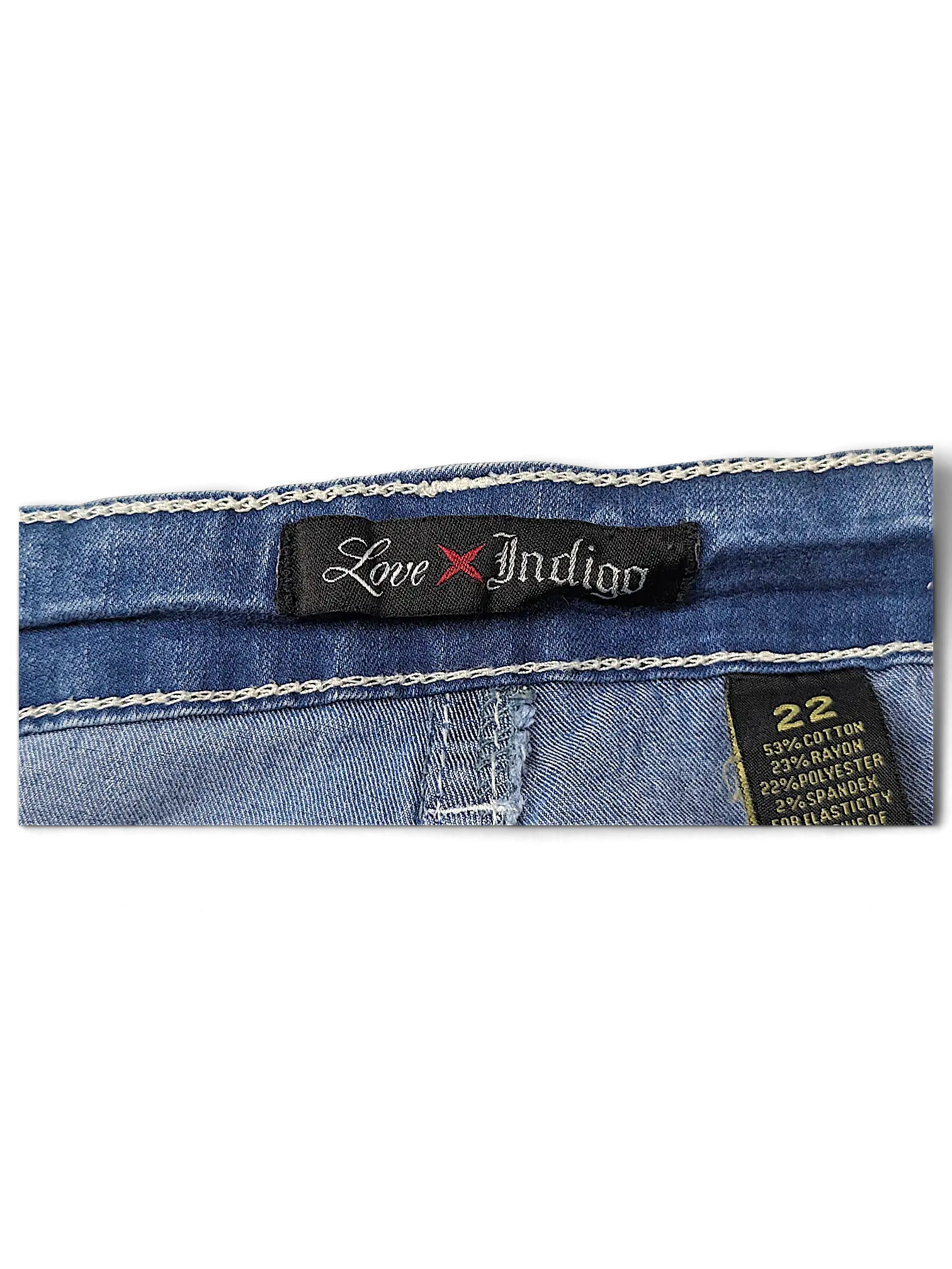 JAKE & IPI Love X Indigo Y2K jeans size 22 featuring a black brand label and white contrast stitching on blue denim.