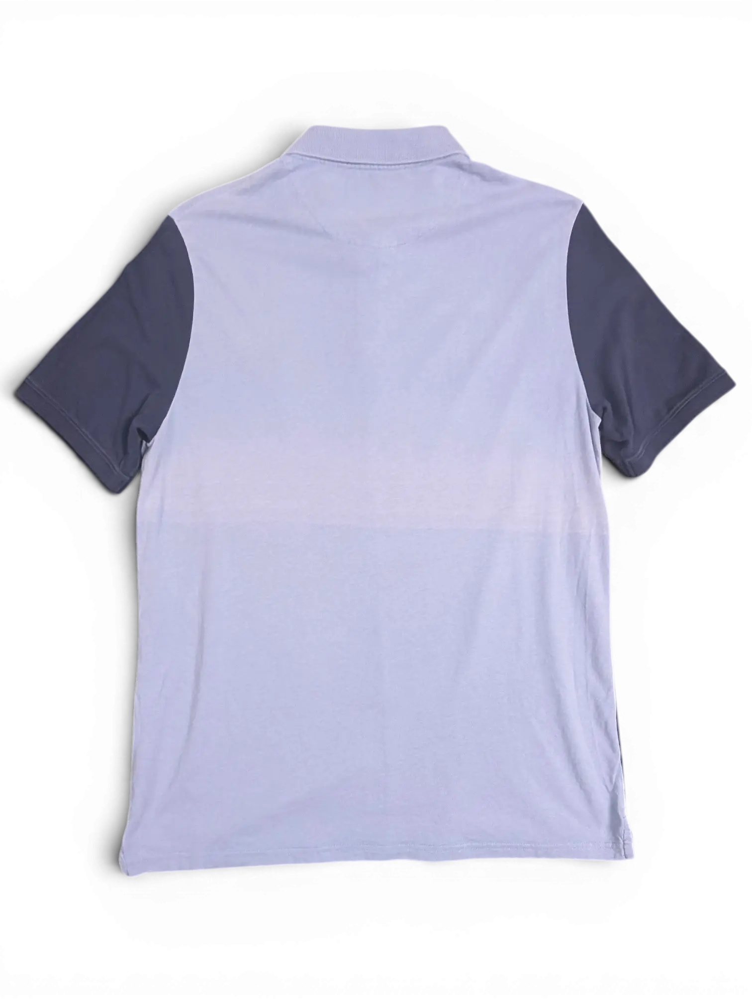 Back view of JAKE & IPI Lyle & Scott color block polo shirt in light blue and navy against a black background.