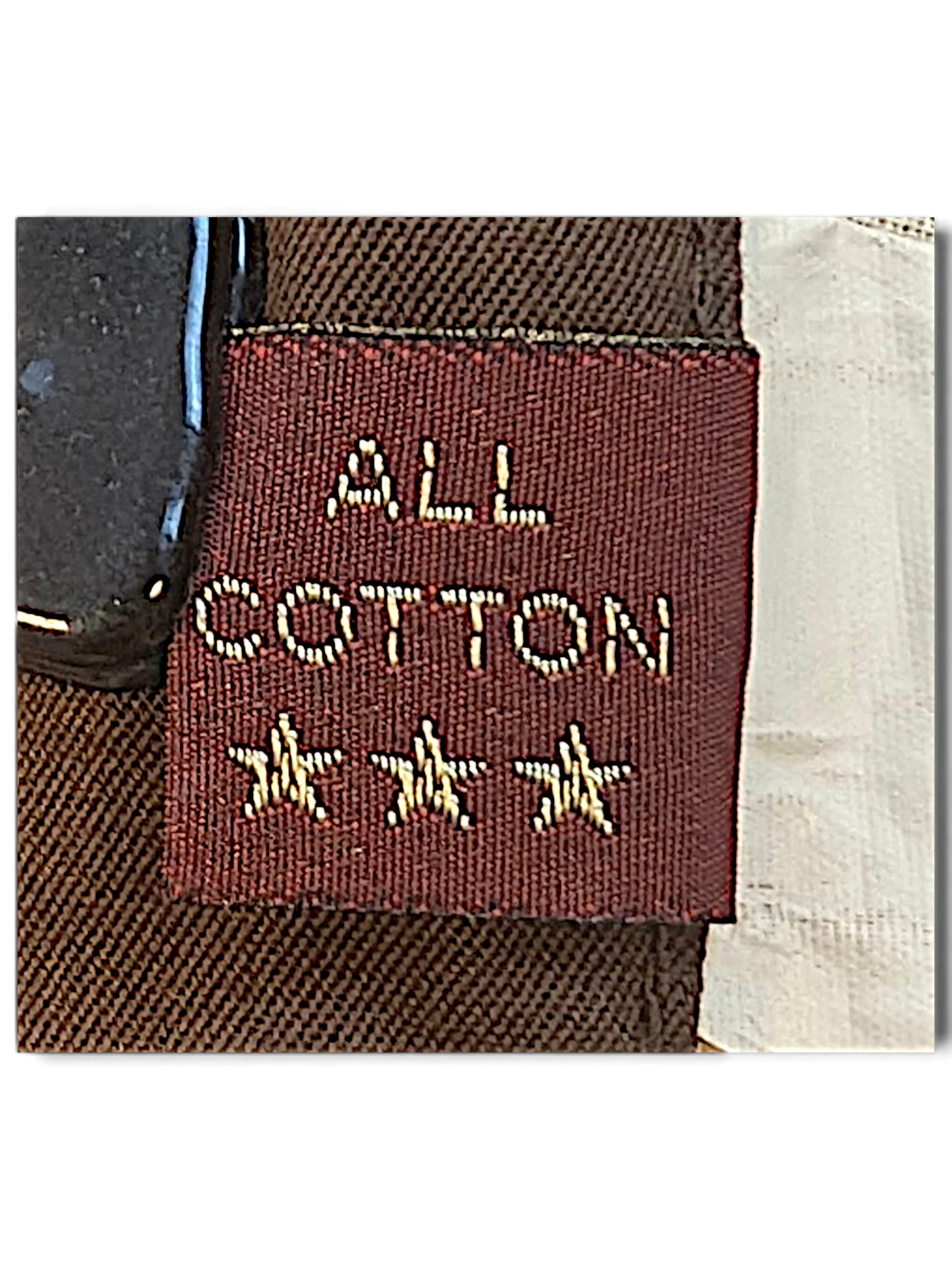 JAKE & IPI Marlboro Classics brown cotton chino label detail showing All Cotton text and three embroidered stars