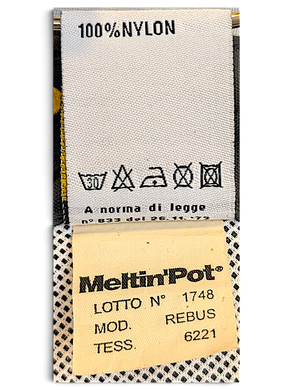 JAKE & IPI Meltin'Pot clothing care label showing 100% nylon composition and washing instructions