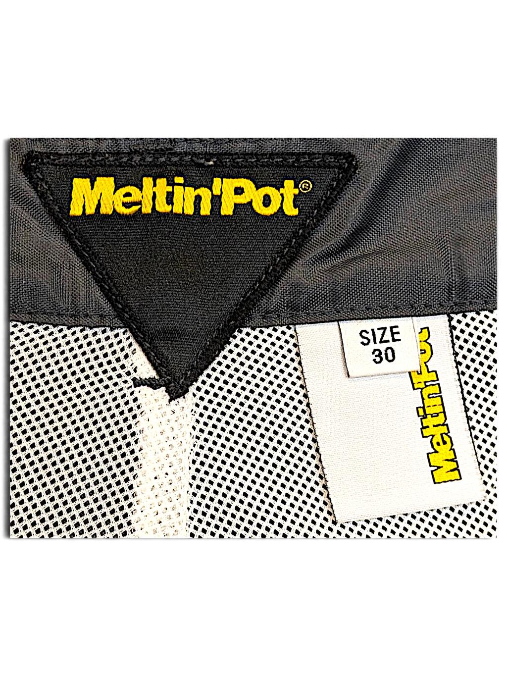 JAKE & IPI Meltin'Pot windbreaker pants interior label showing size 30 and brand logo on dark khaki fabric