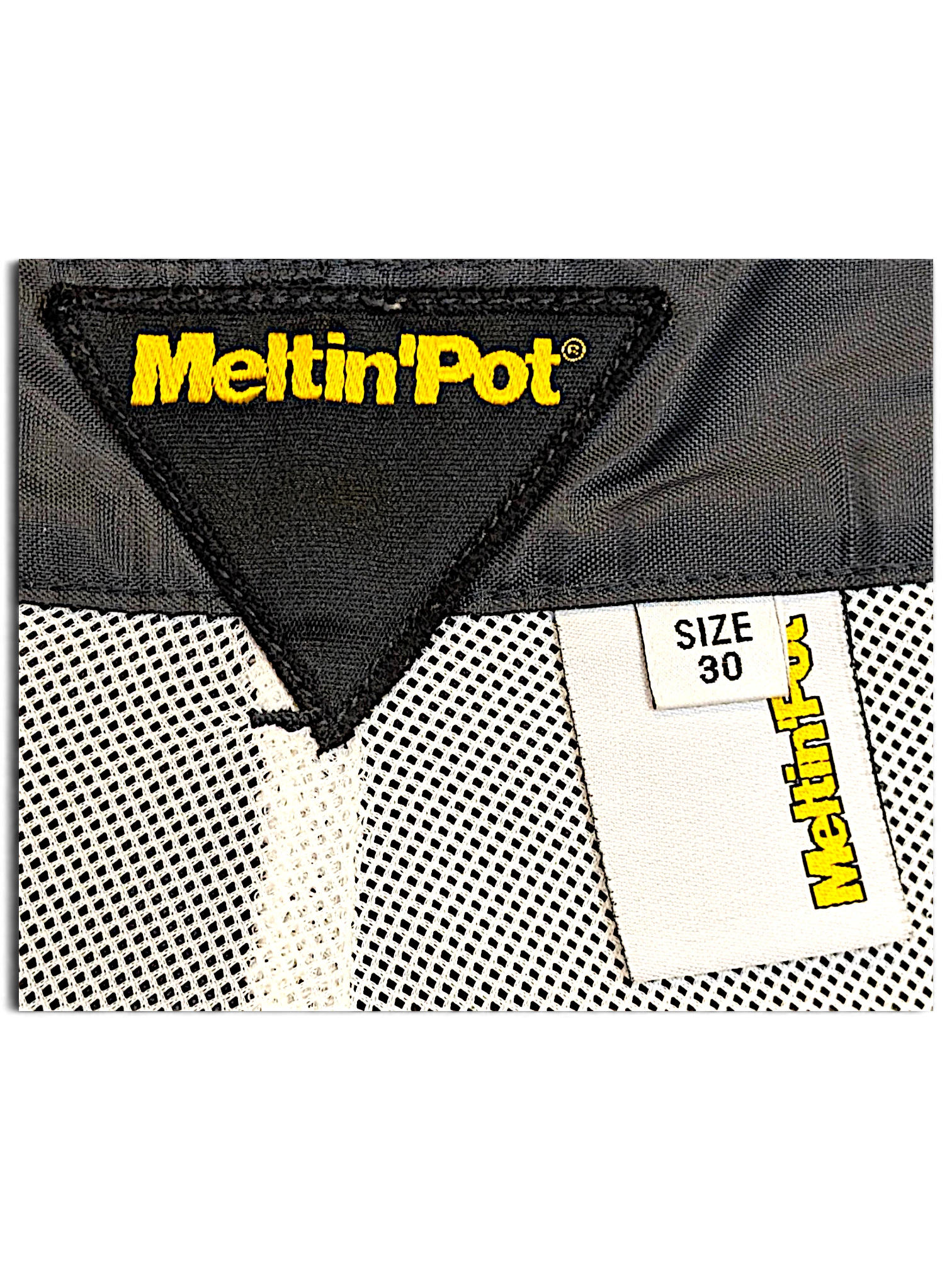 JAKE & IPI Meltin'Pot windbreaker pants interior label showing size 30 and brand logo on dark khaki fabric