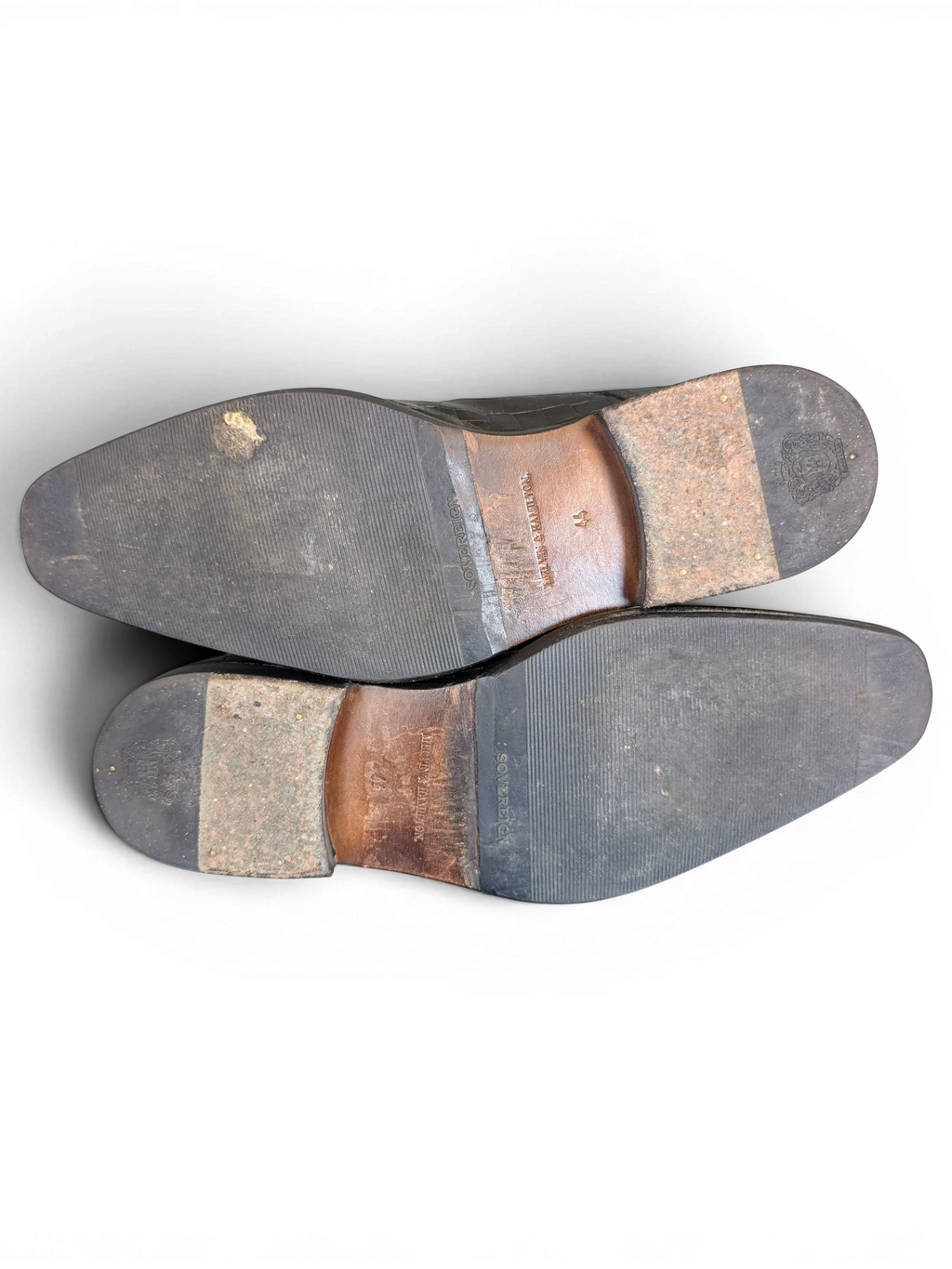 JAKE & IPI Melvin & Hamilton dark leather ankle boot soles with visible wear and embossed branding