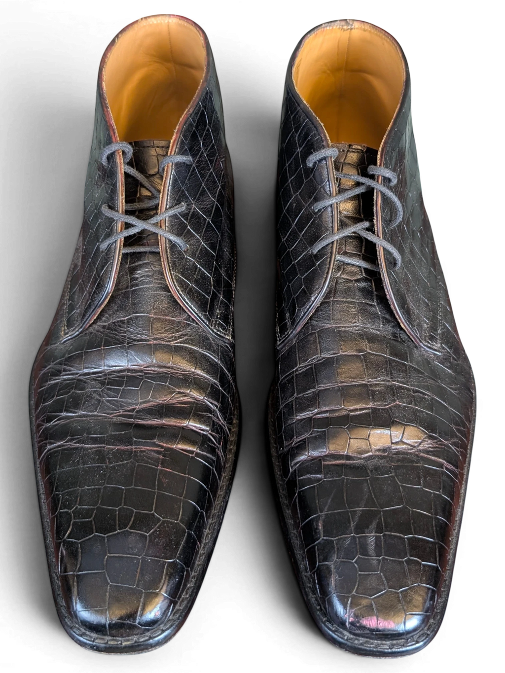 JAKE & IPI Melvin & Hamilton dark brown crocodile-embossed leather ankle boots with lace-up closure.